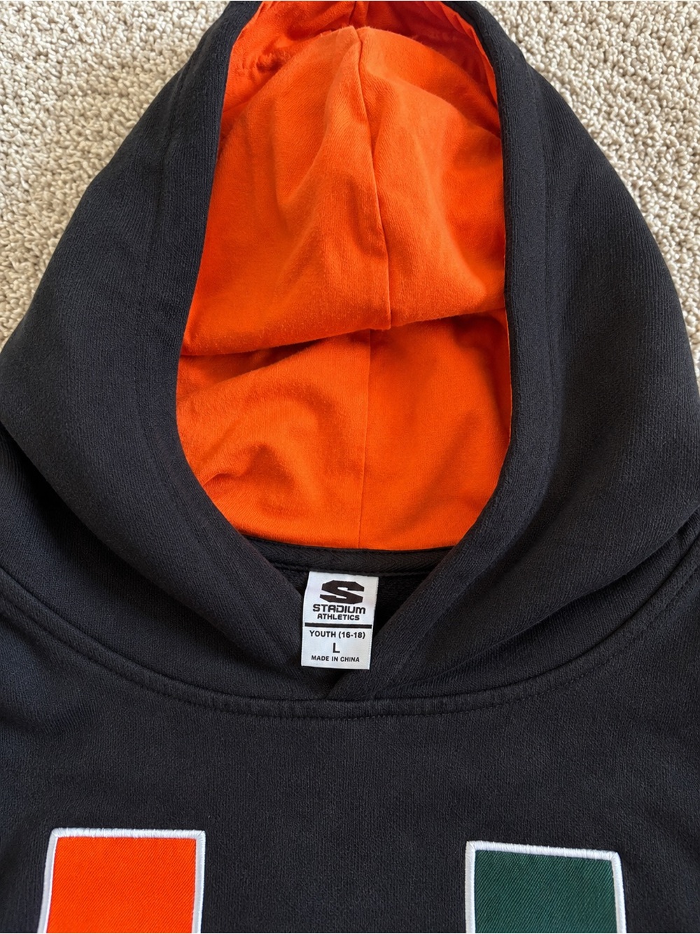 Stadium Athletics Black Hoodie with Orange Lining and Green Accent